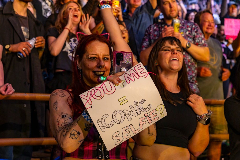 Fans packed Red Rocks with handmade signs.