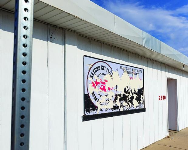 old gym sign on wall