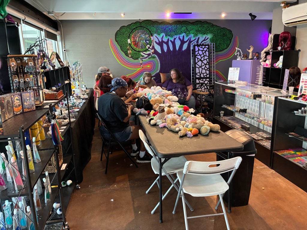People work on a craft inside a store