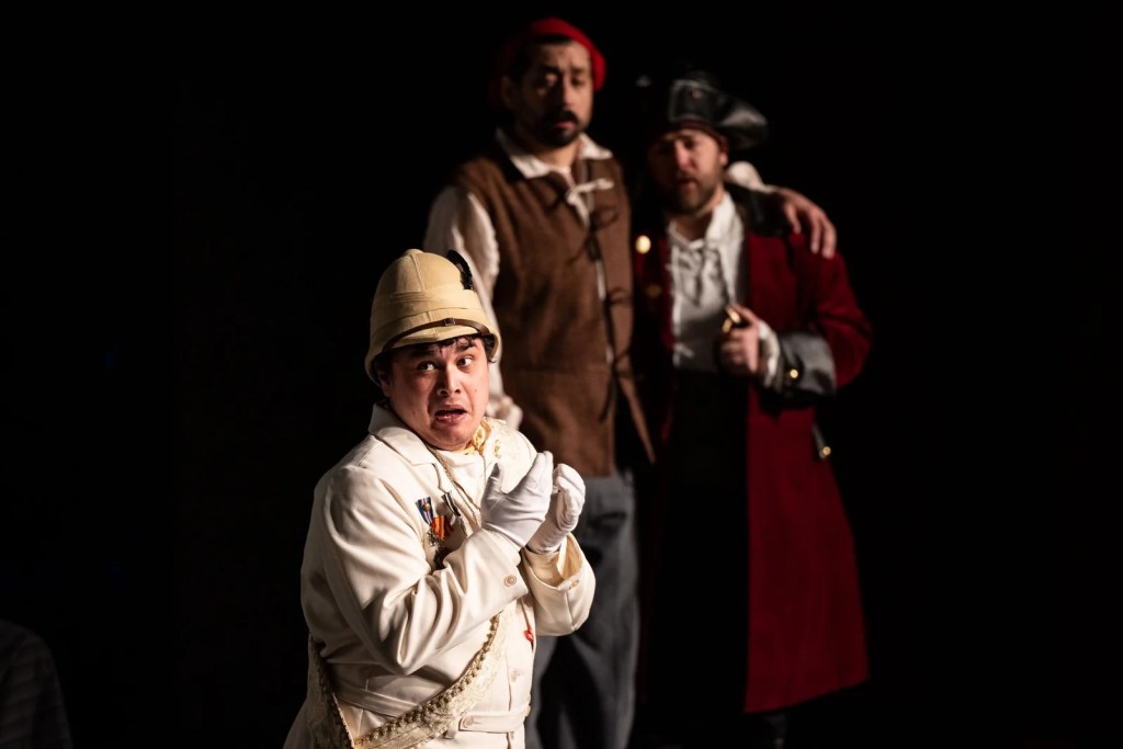 Three opera singers perform