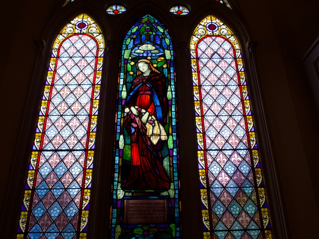 Windows restored by Watkins Stained Glass at Evans Memorial Chapel.