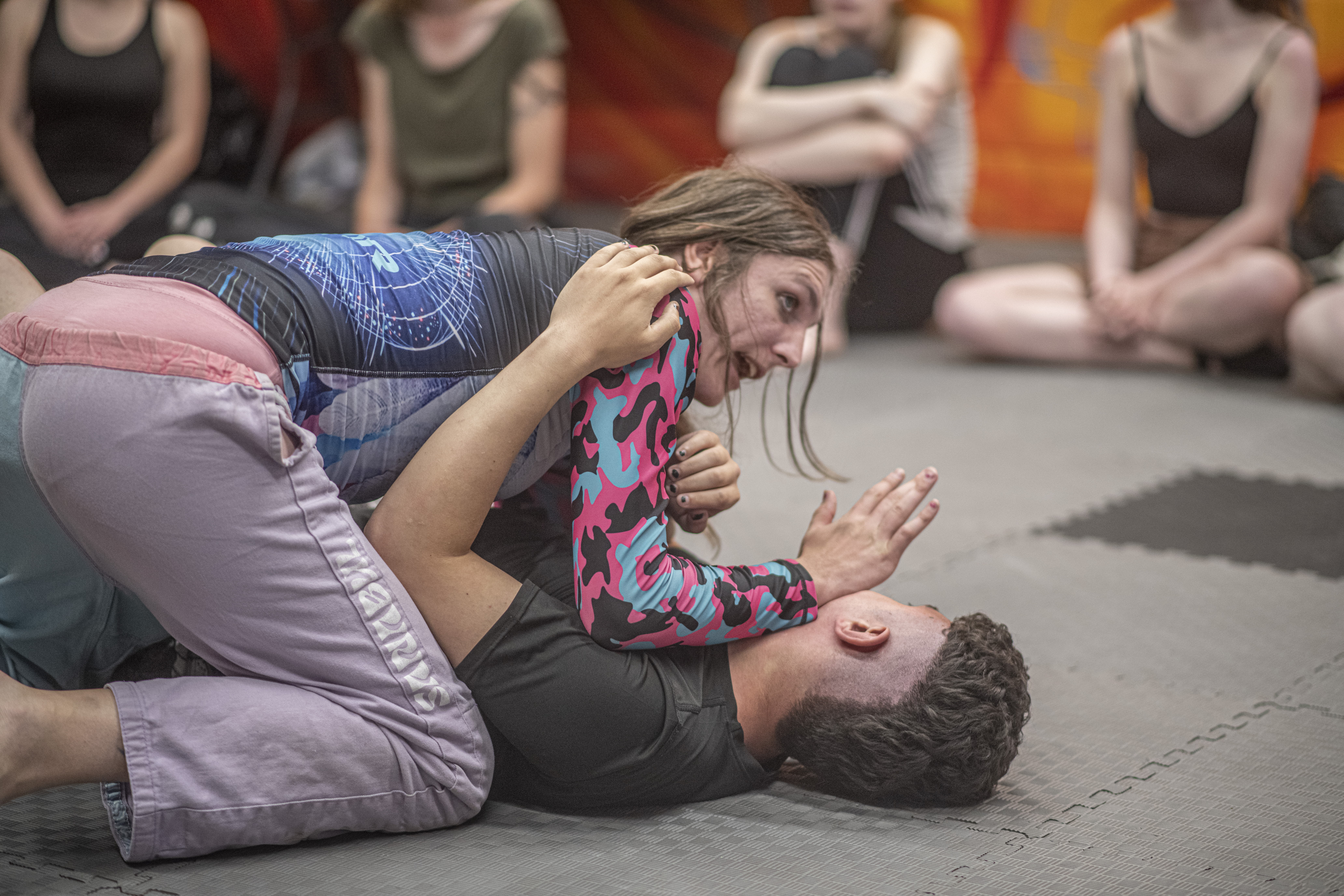 Sybil Vane holds a jiu-jitsu instruction course.