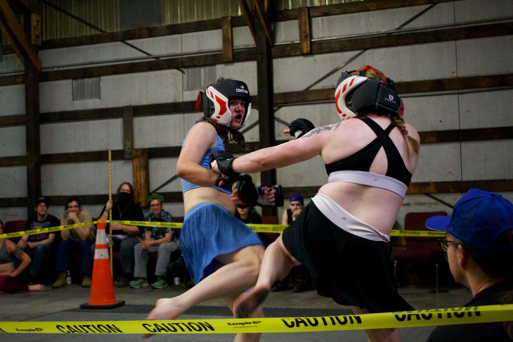 Trans MMA fighters compete in the ring at Queer Bash.