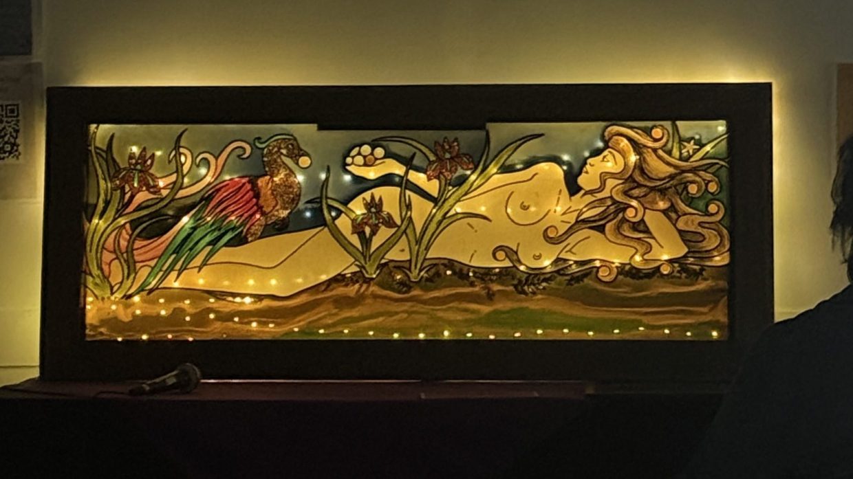 stained glass art of a naked woman