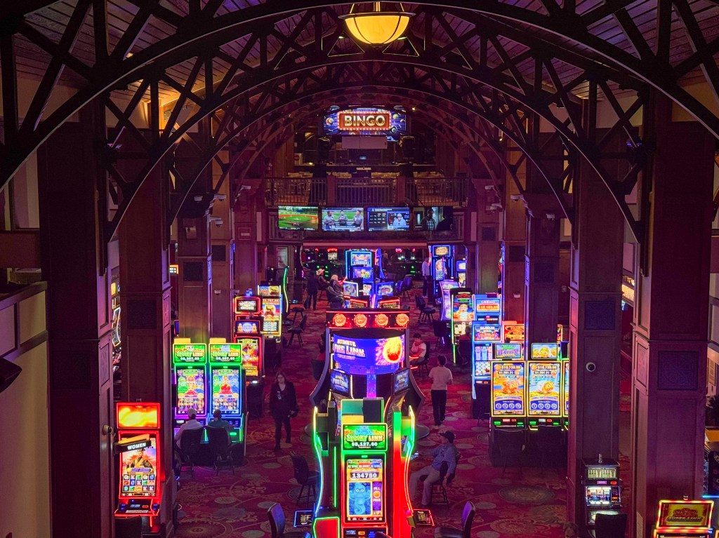 The view of the casino floor from the upper level at Lady Luck Casino in Black Hawk, including slot machines and table games.