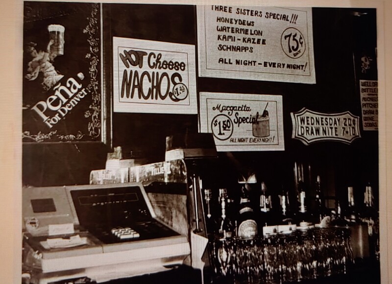 a black and white photo of a bar