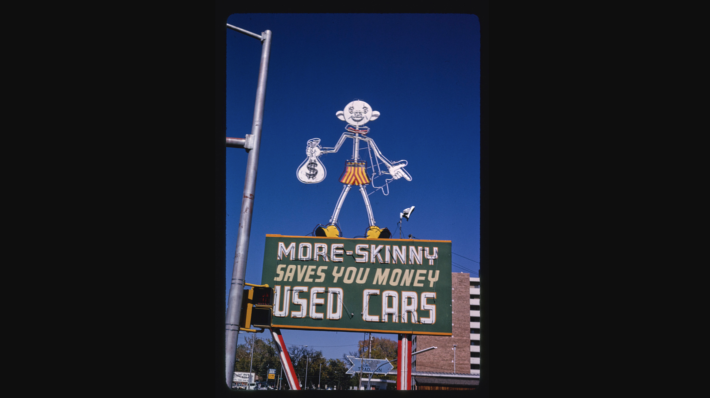 More-Skinny Used Cars sign in Pueblo