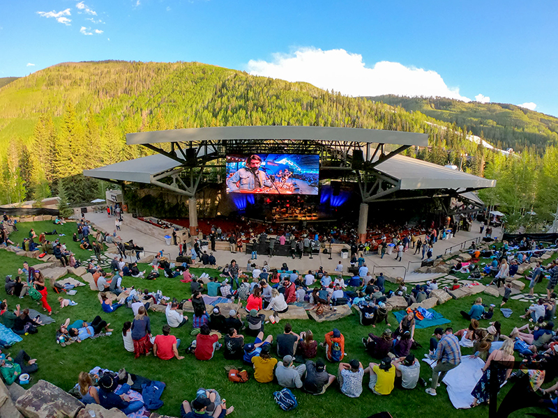 people in mountains listening to music
