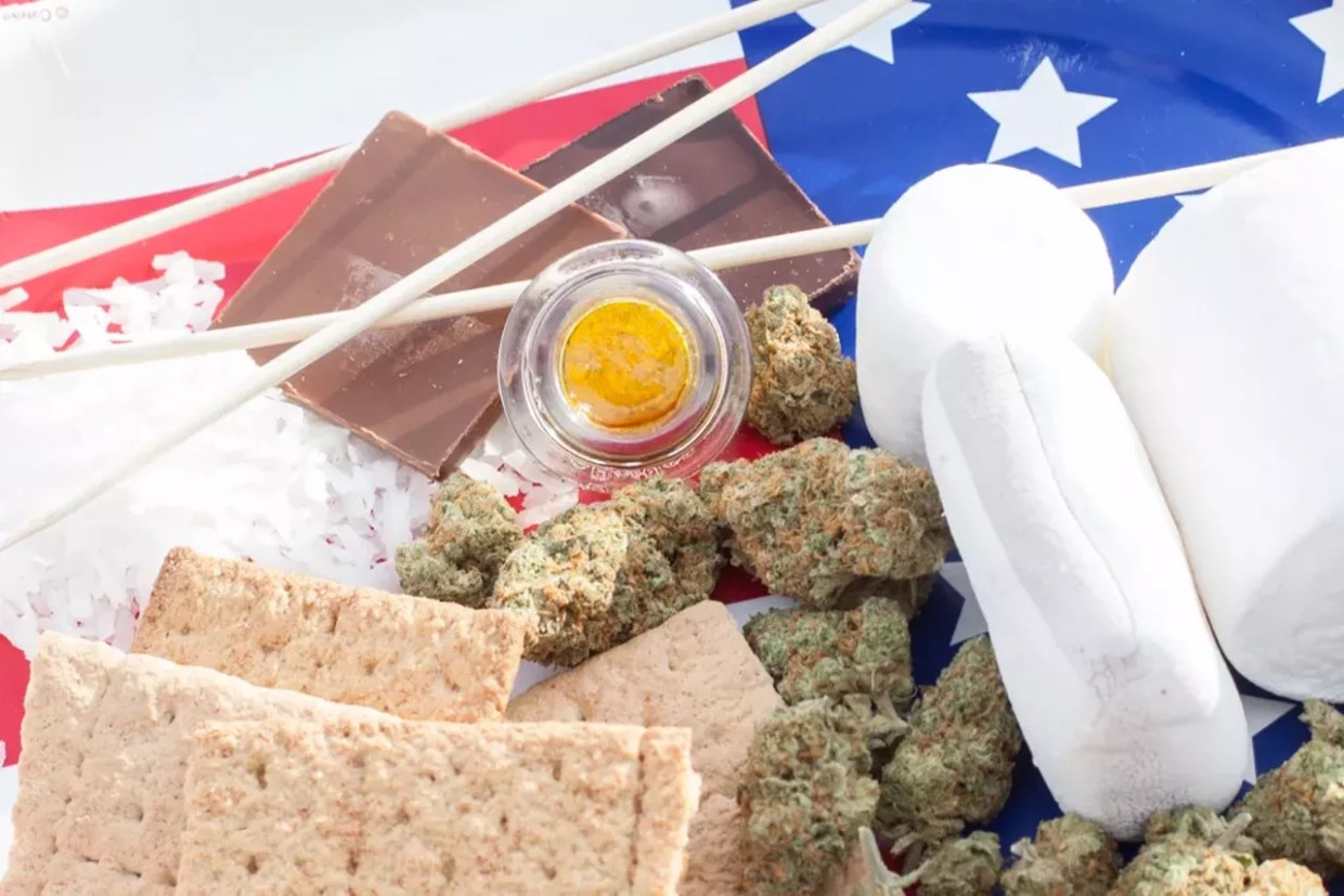 Marijuana, hash and s'more ingredients placed next to an American flag
