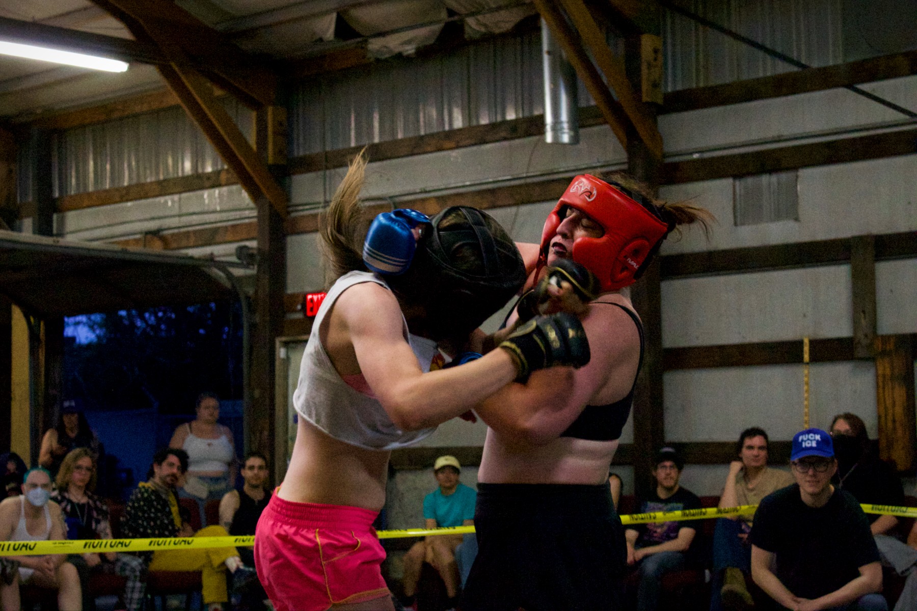 Trans MMA fighters punch each other during a Queer Bash fight in Denver.