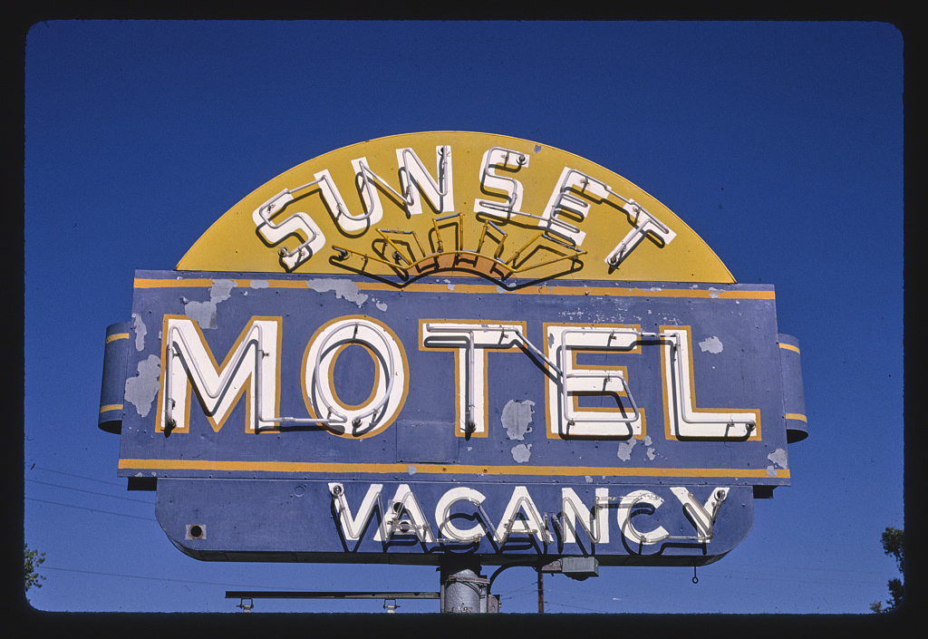 Sunset motel neon sign in pueblo, 1980.