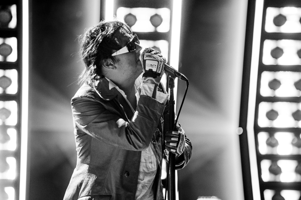 A photo of The Strokes performing live at Red Rocks on July 22.