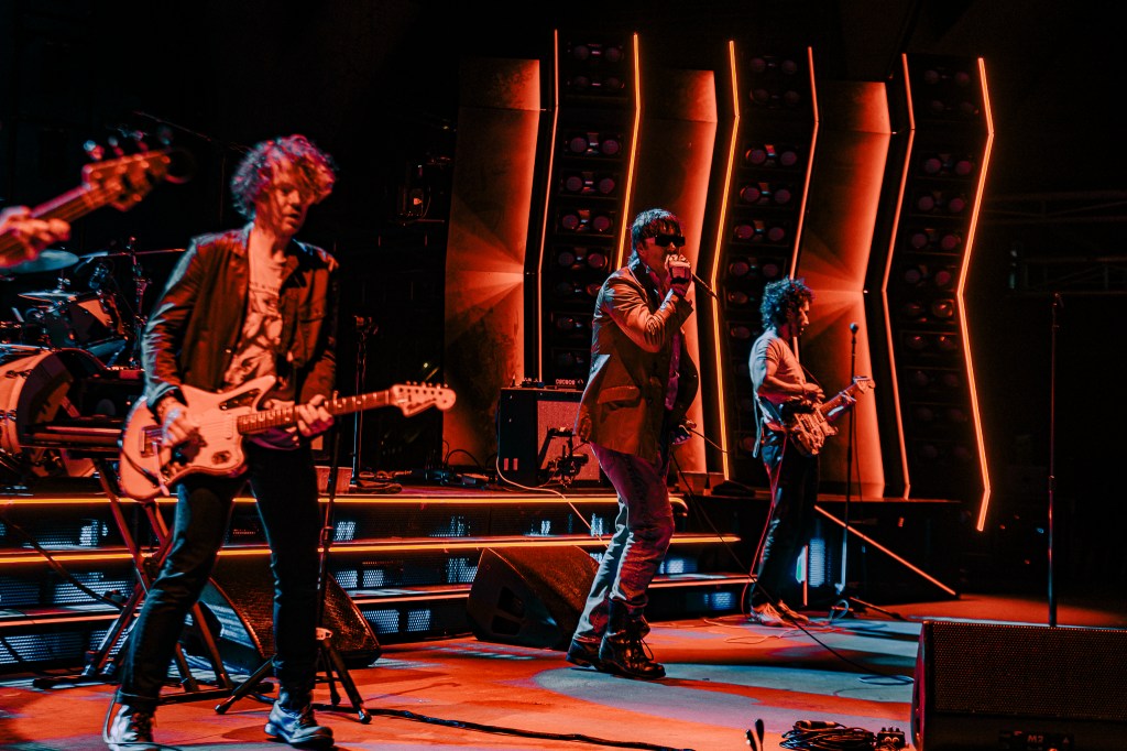A photo of The Strokes performing live at Red Rocks on July 22.