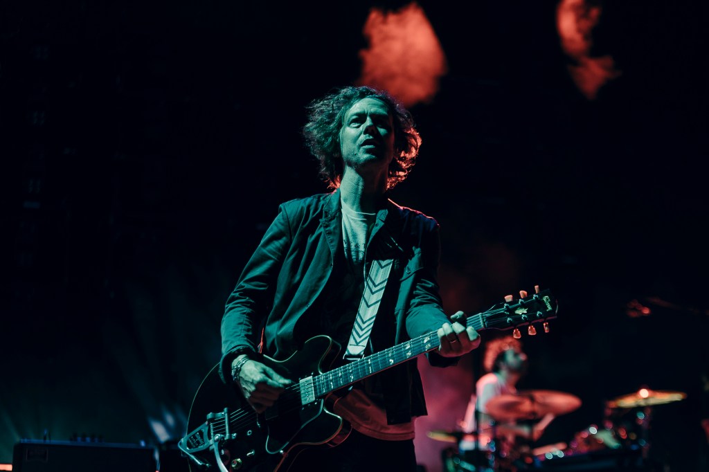 A photo of The Strokes performing live at Red Rocks on July 22.