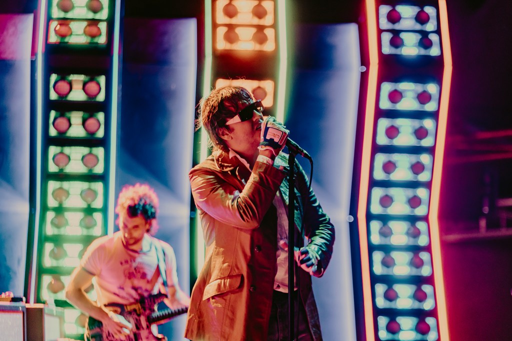 A photo of The Strokes performing live at Red Rocks on July 22.