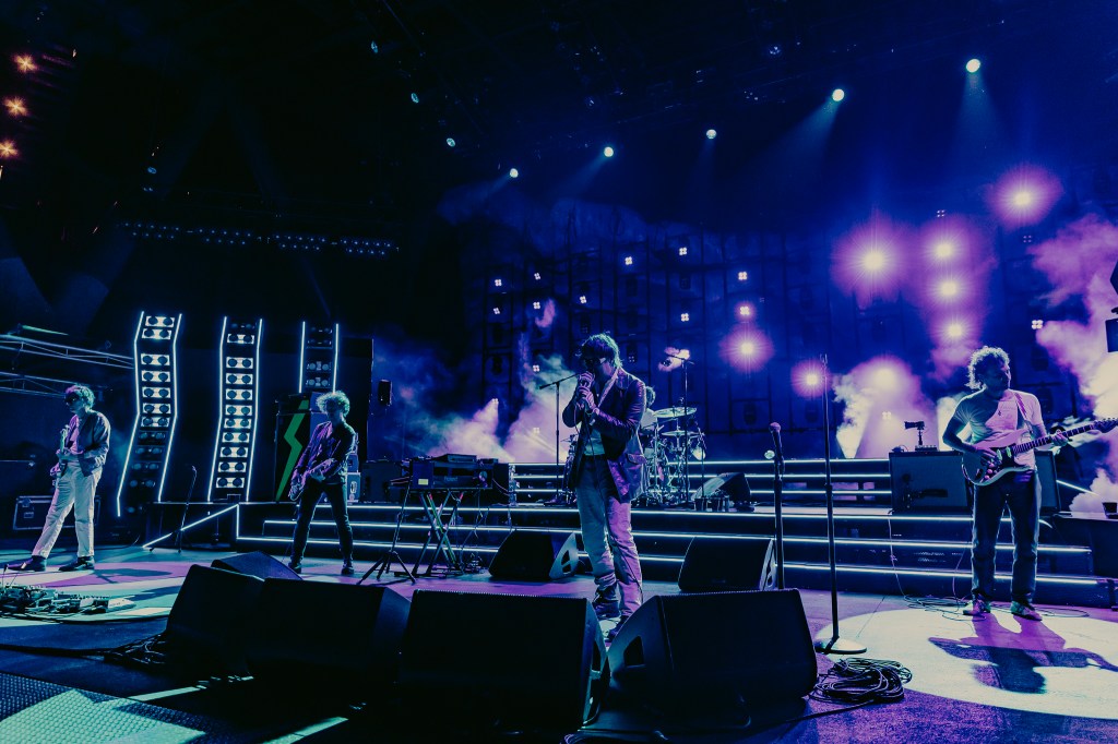 A photo of The Strokes performing live at Red Rocks on July 22.