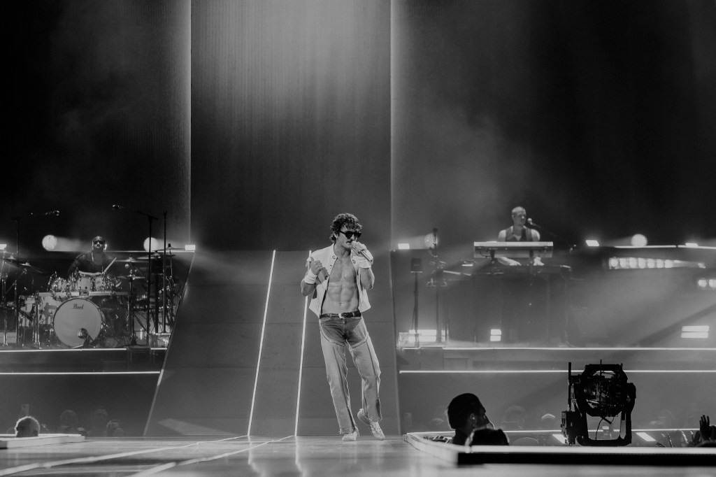 Benson Boone performing live at Ball Arena in Denver, Colorado, on July 30 for his Wanted Man Tour 2026.