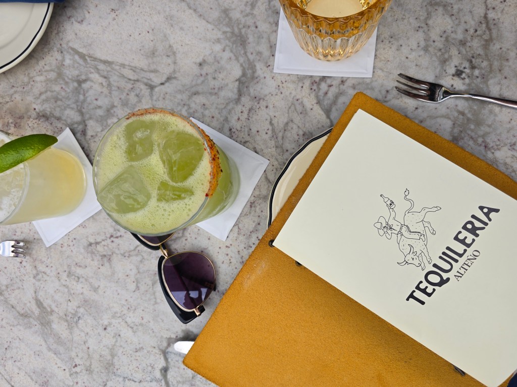 Tequilería Alteño menu next to a tomatillo cocktail