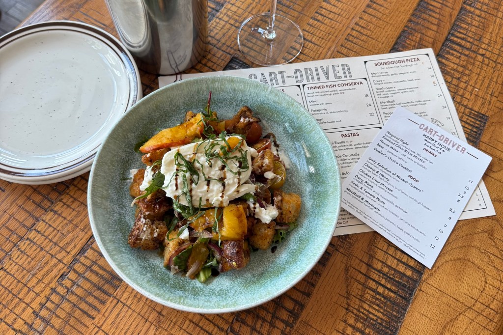 Marinated peaches in a panzanella salad