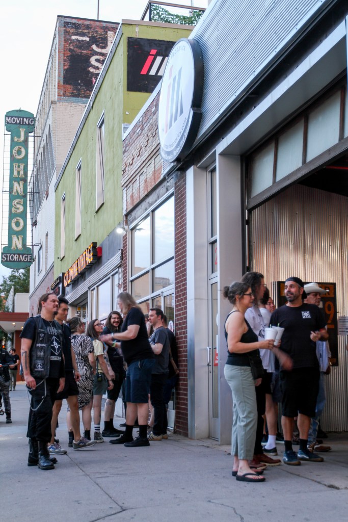 A crowd gathers outside Import Mechanics during Cobranoid's 8 p.m. set on Saturday, July 25.