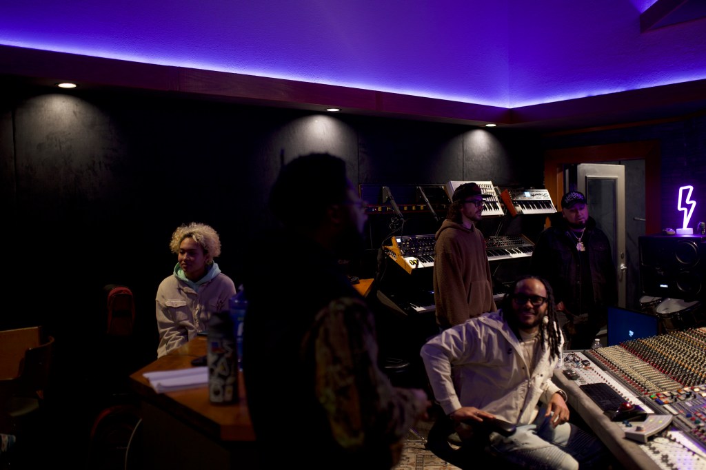 five people in recording studio