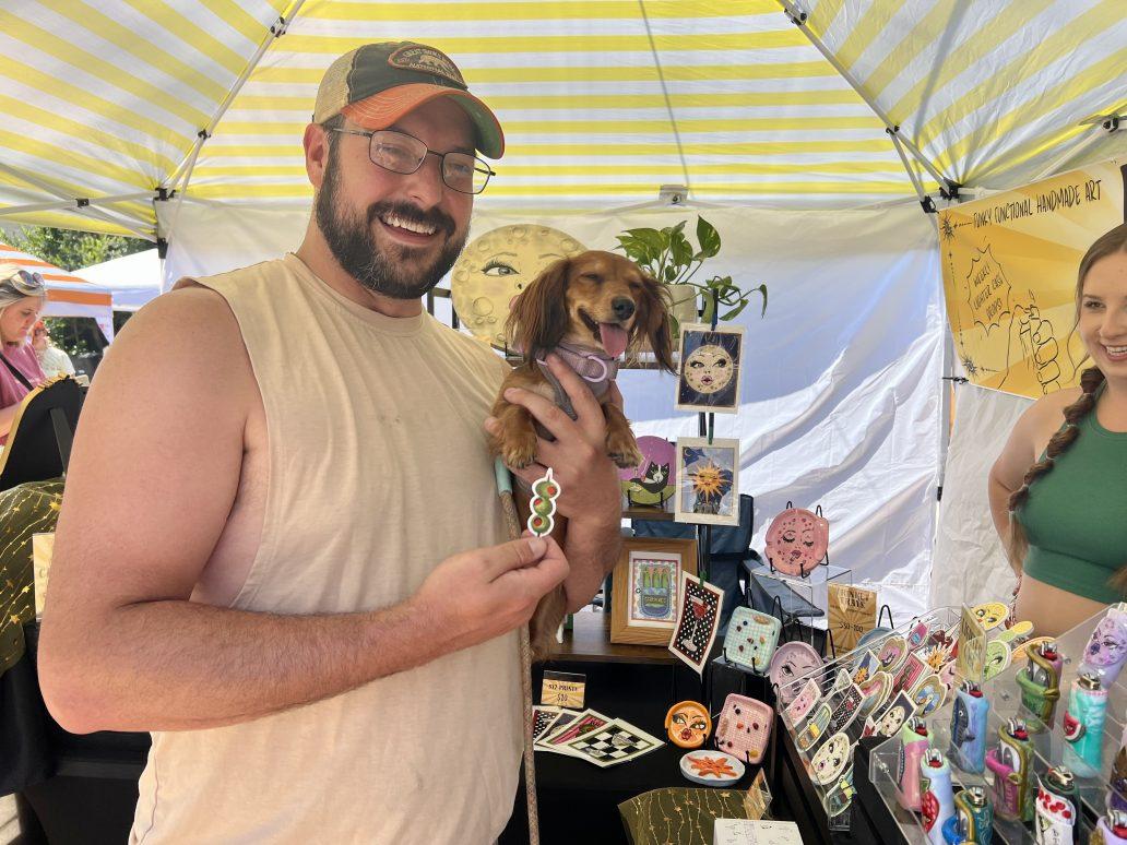 Braden Nelson with Olive the dachshund at Good Kid Secret Market.