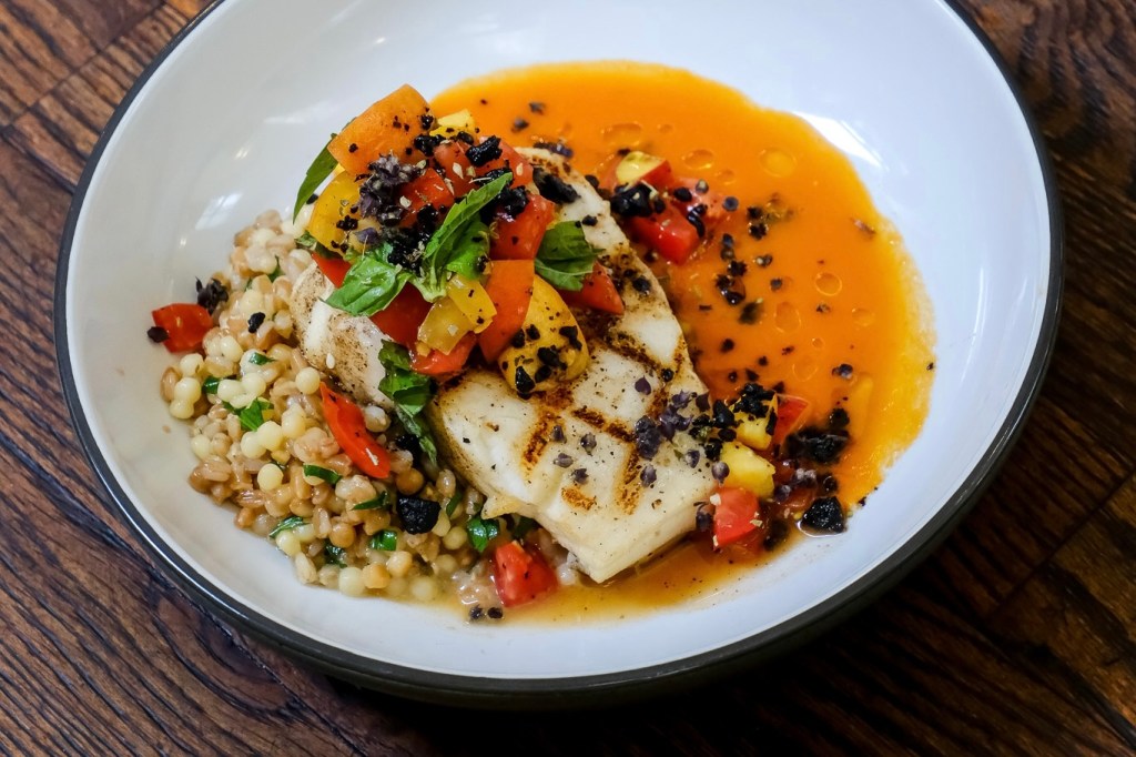 A peach and tomato relish on grilled sea bass