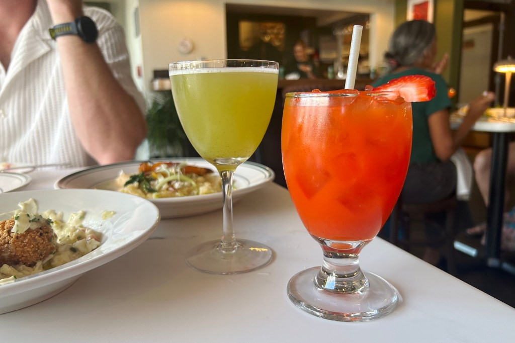 A green-hued mezcal cocktail and vibrant glass of strawberry-red bell pepper lemonade