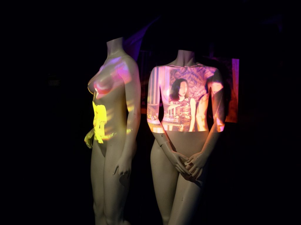 video projected on two mannequins