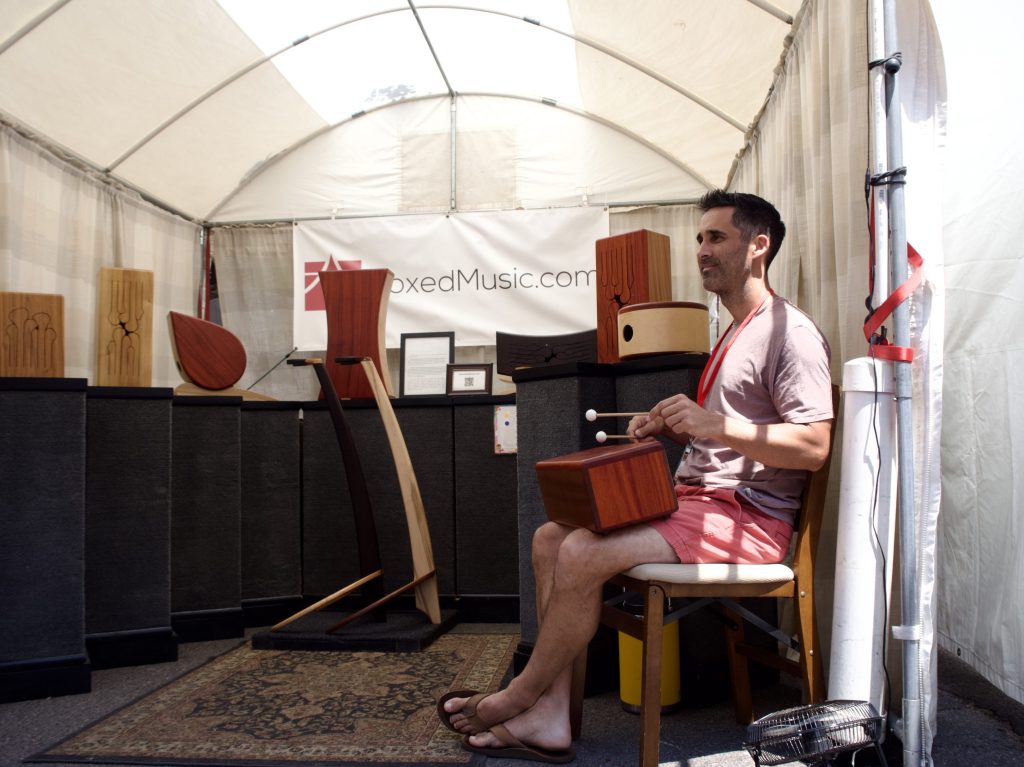 A man plays an instrument