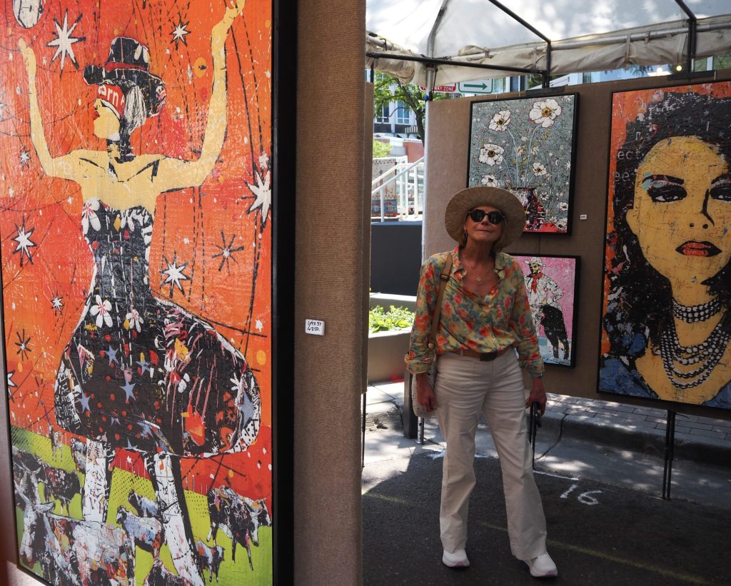 People look at art at the Cherry Creek Arts Festival