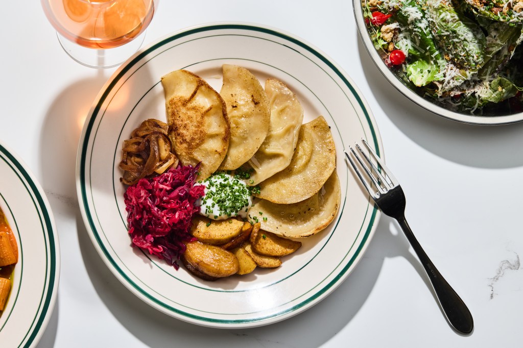 Pierogies served with beet kraut, apples, caramelized onions and coconut sour cream