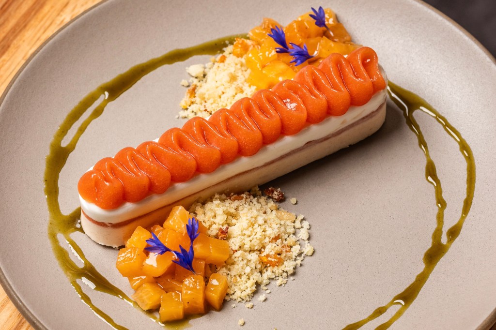 Peaches served alongside a semifreddo dessert