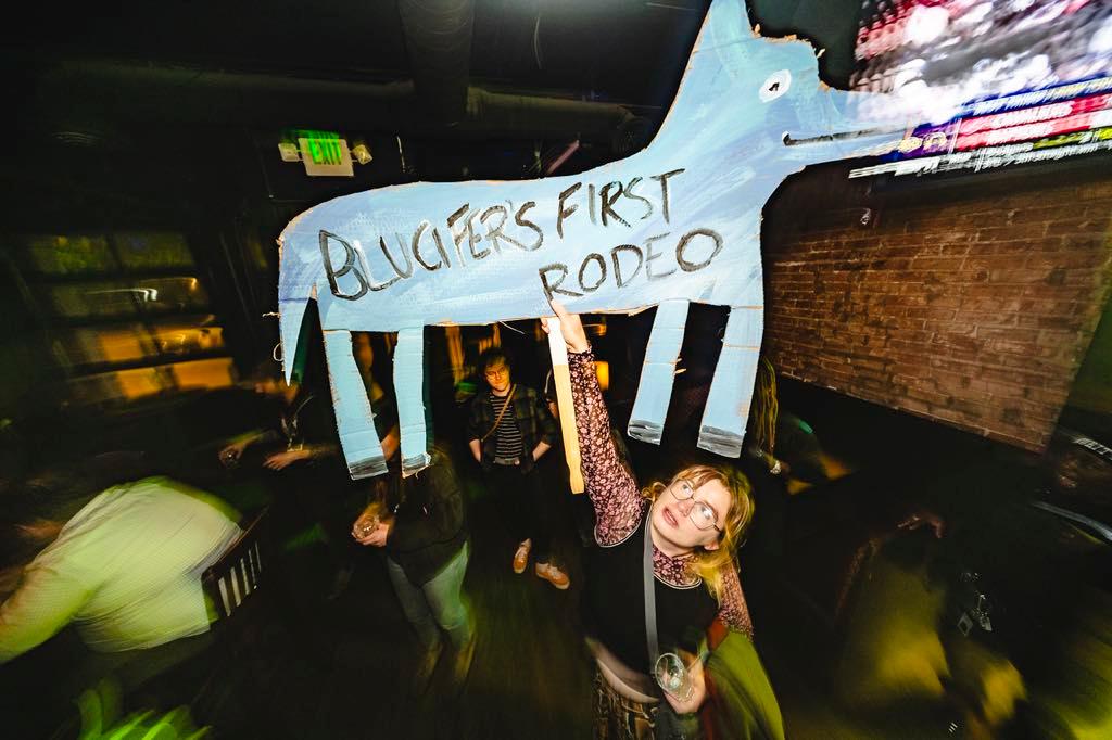 woman holding a cardboard horse