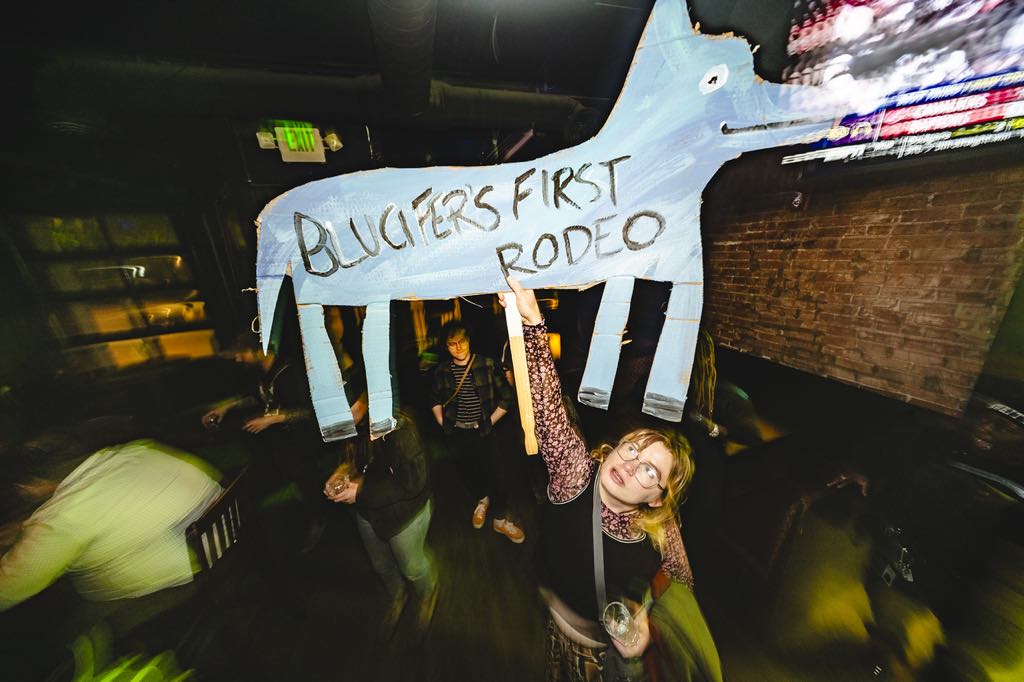 woman holding a cardboard horse