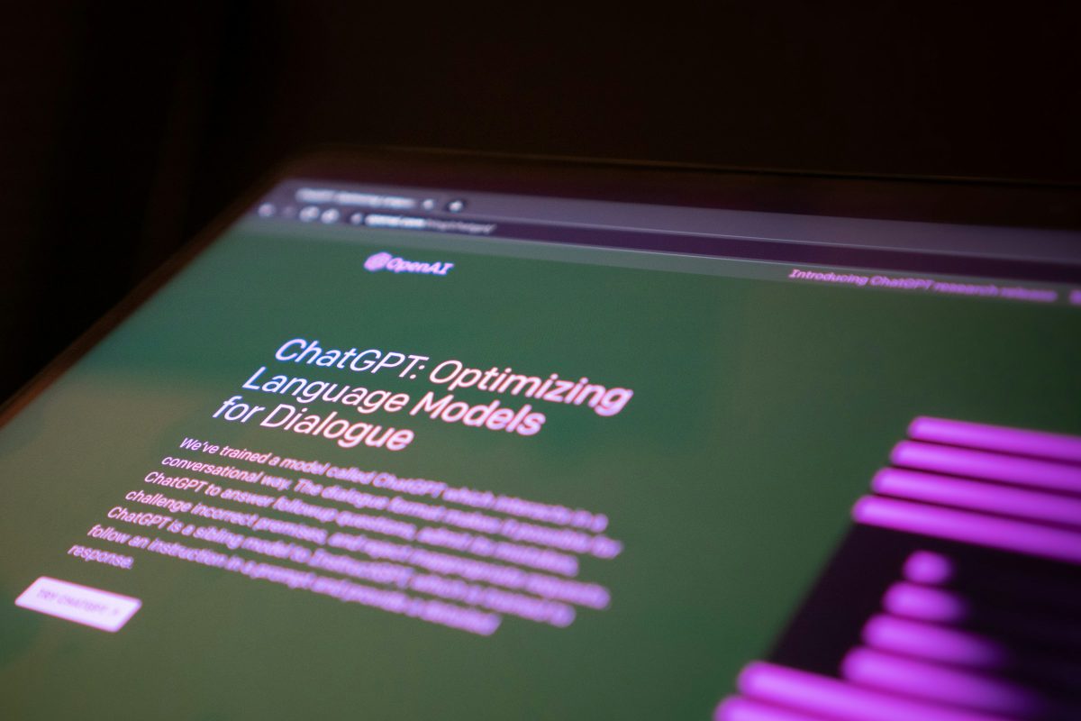 The welcome screen for the OpenAI “ChatGPT” app is displayed on a laptop screen in a photo illustration.