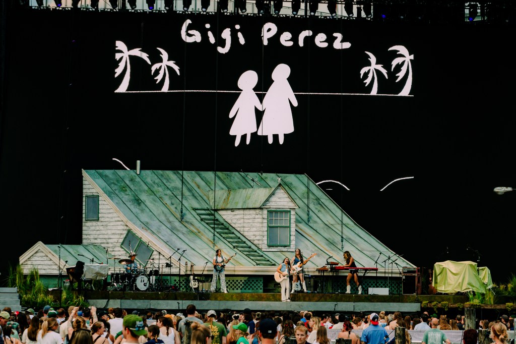 Gigi Perez performing live at Coors Field in Denver, Colorado for Noah Kahan's The Great Divide Tour.