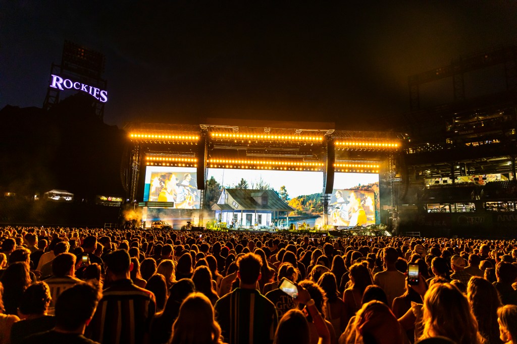 Noah Kahan performing live at Coors Field in Denver, Colorado for night one of two of The Great Divide Tour.