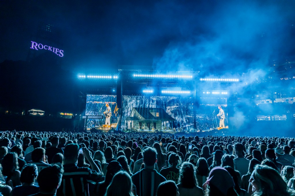 Noah Kahan performing live at Coors Field in Denver, Colorado for night one of two of The Great Divide Tour.