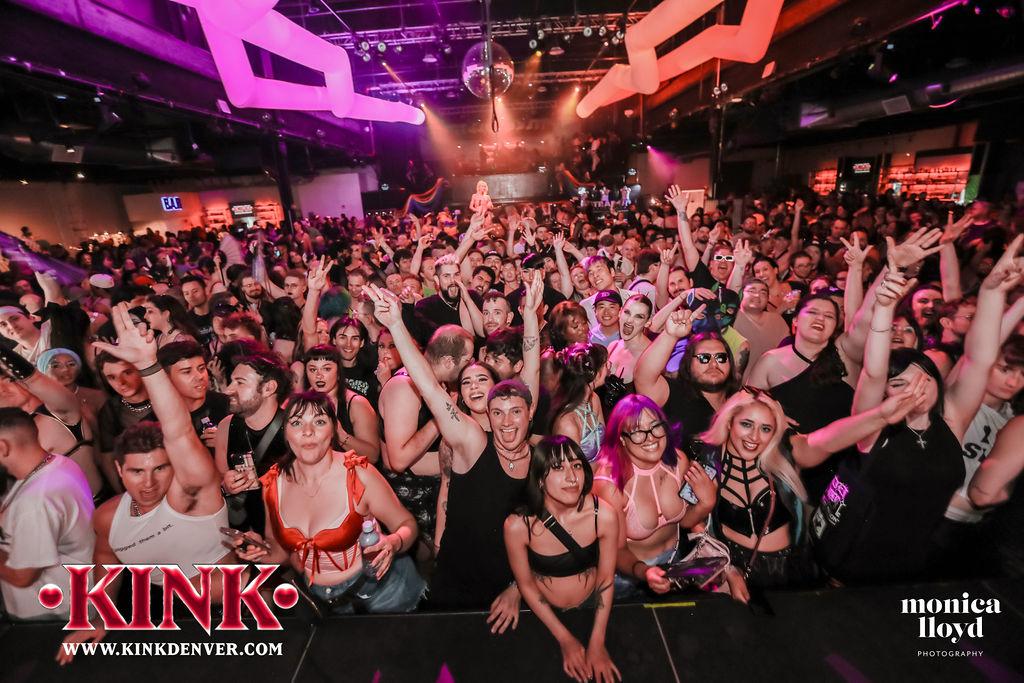 a crowd of people at a nightclub event