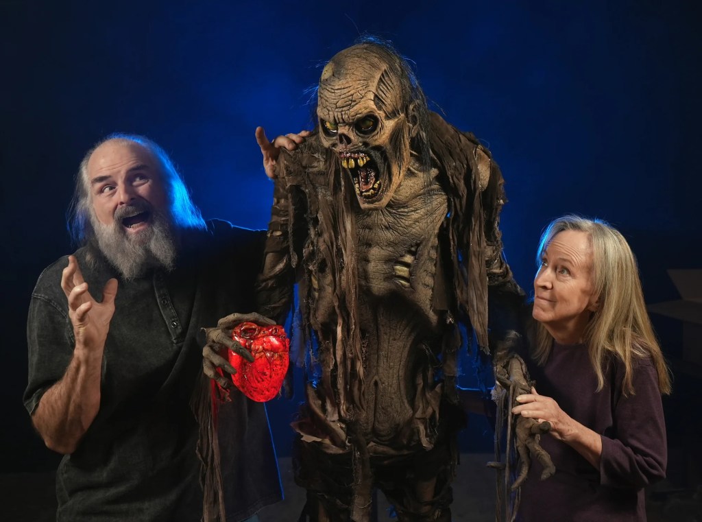 Marsha Taub-Edmunds and Ed Edmunds with a mummy Halloween prop