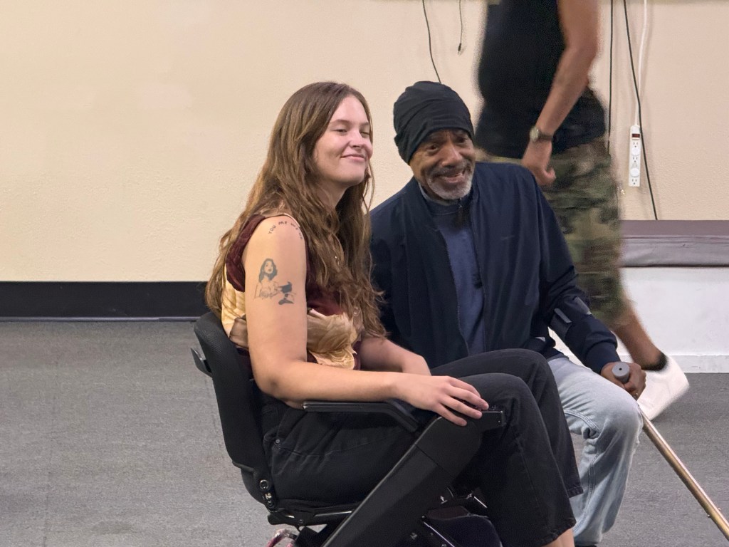 Two people pose for a photo