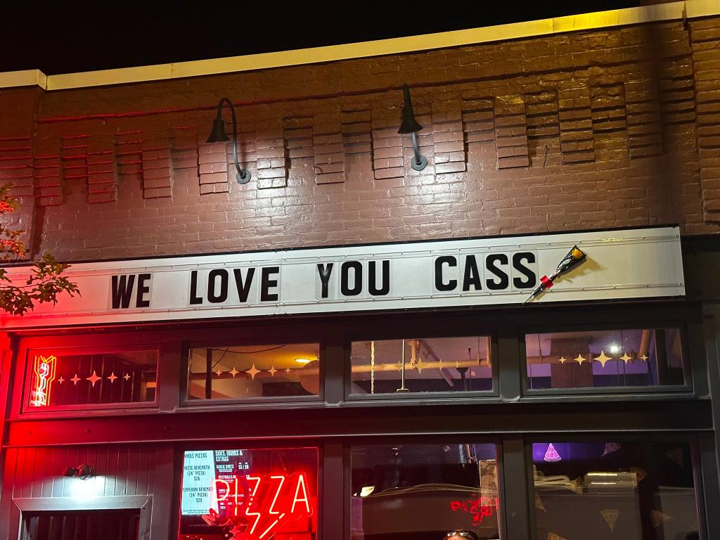 The marquee outside Denver's Marquis Theater reads "We love you Cass."