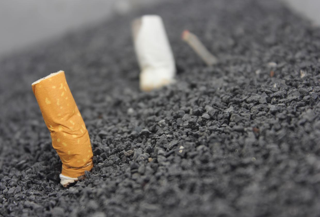 cigarette butts put out in gravel