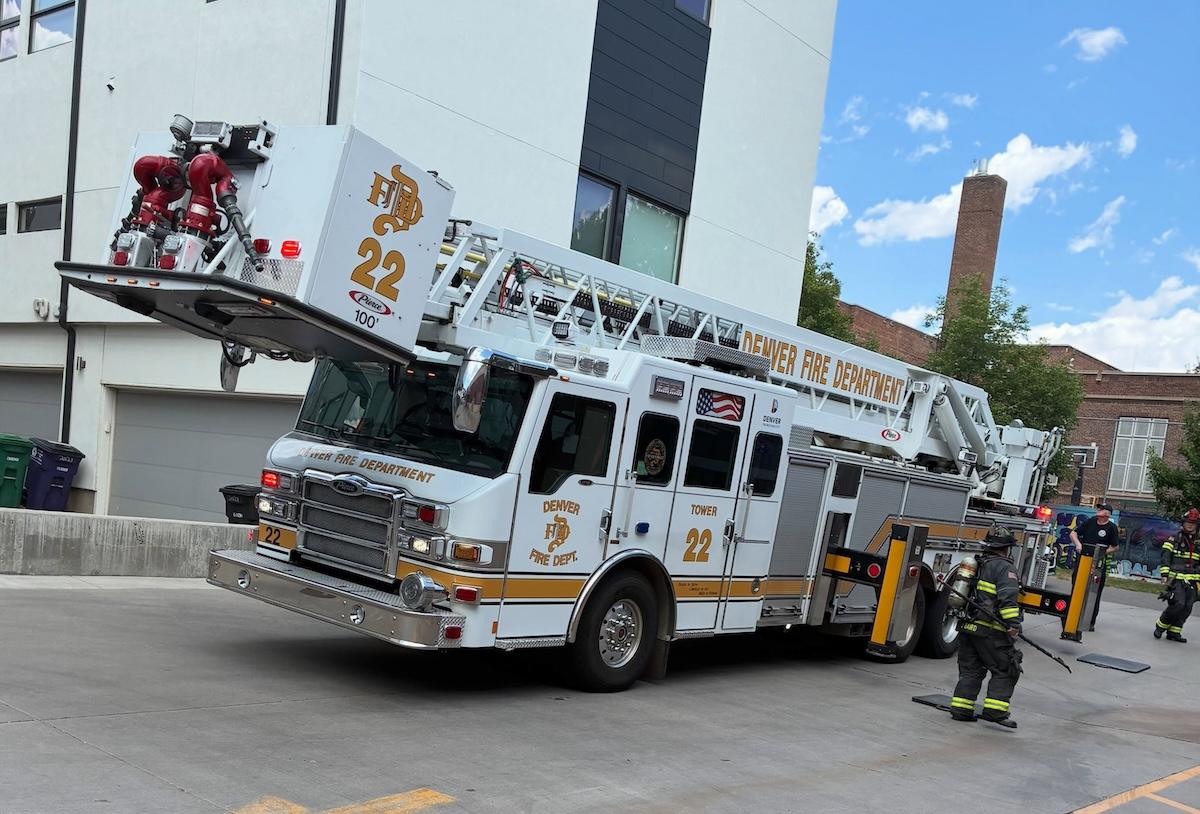 Denver Fire Department fire truck parked outside of a garage