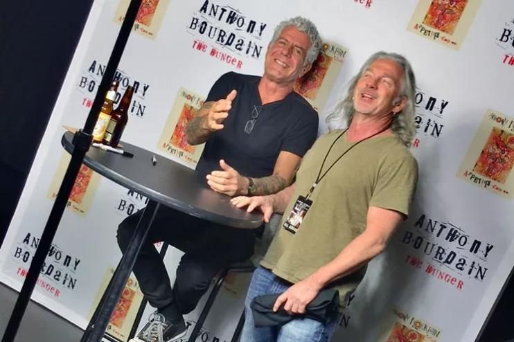 two men posing together