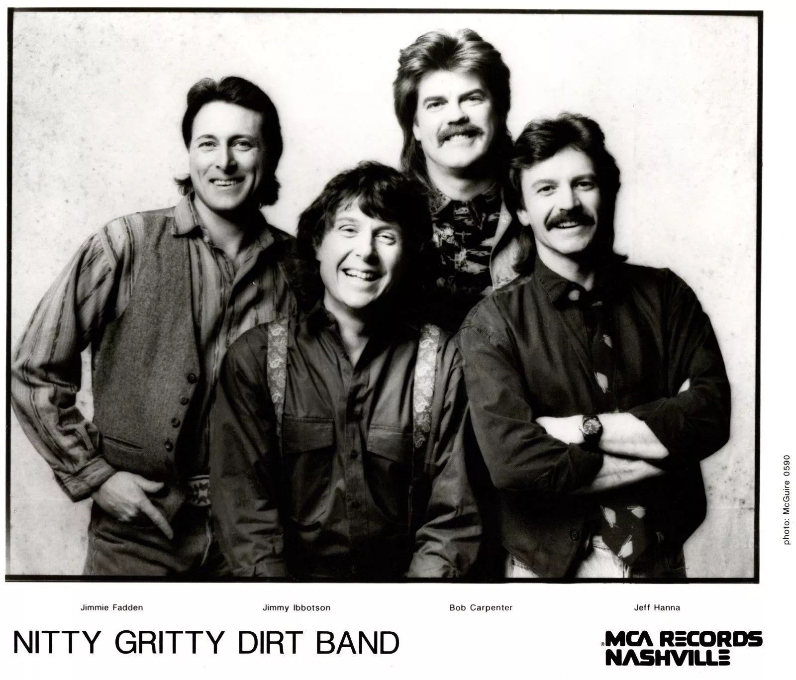 four men smiling