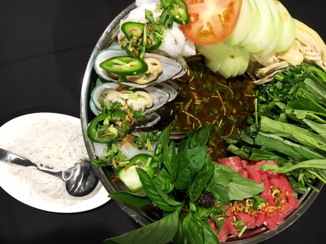 seafood, meat and vegetables in broth