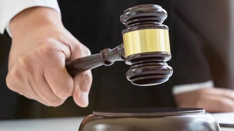gavel in hand.