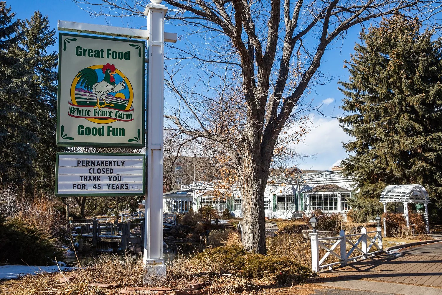 white fence farm sign